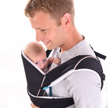Load image into Gallery viewer, A father smiling with his baby in the Cococho Ergonomic baby carrier in the front position